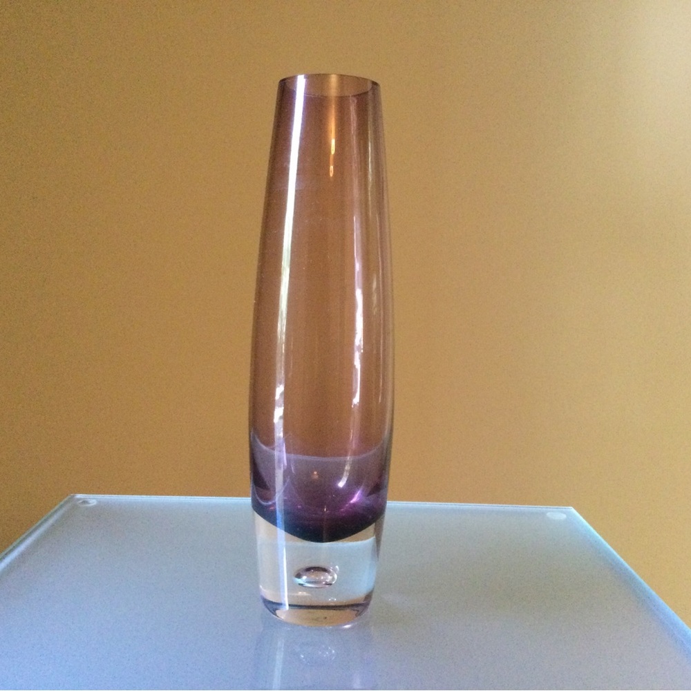 Rose taupe glass vase, approximately 9.75” tall and 2.5” at the widest part.